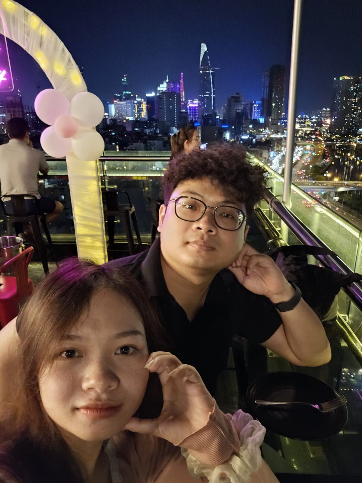Rooftop date, Saigon skyline